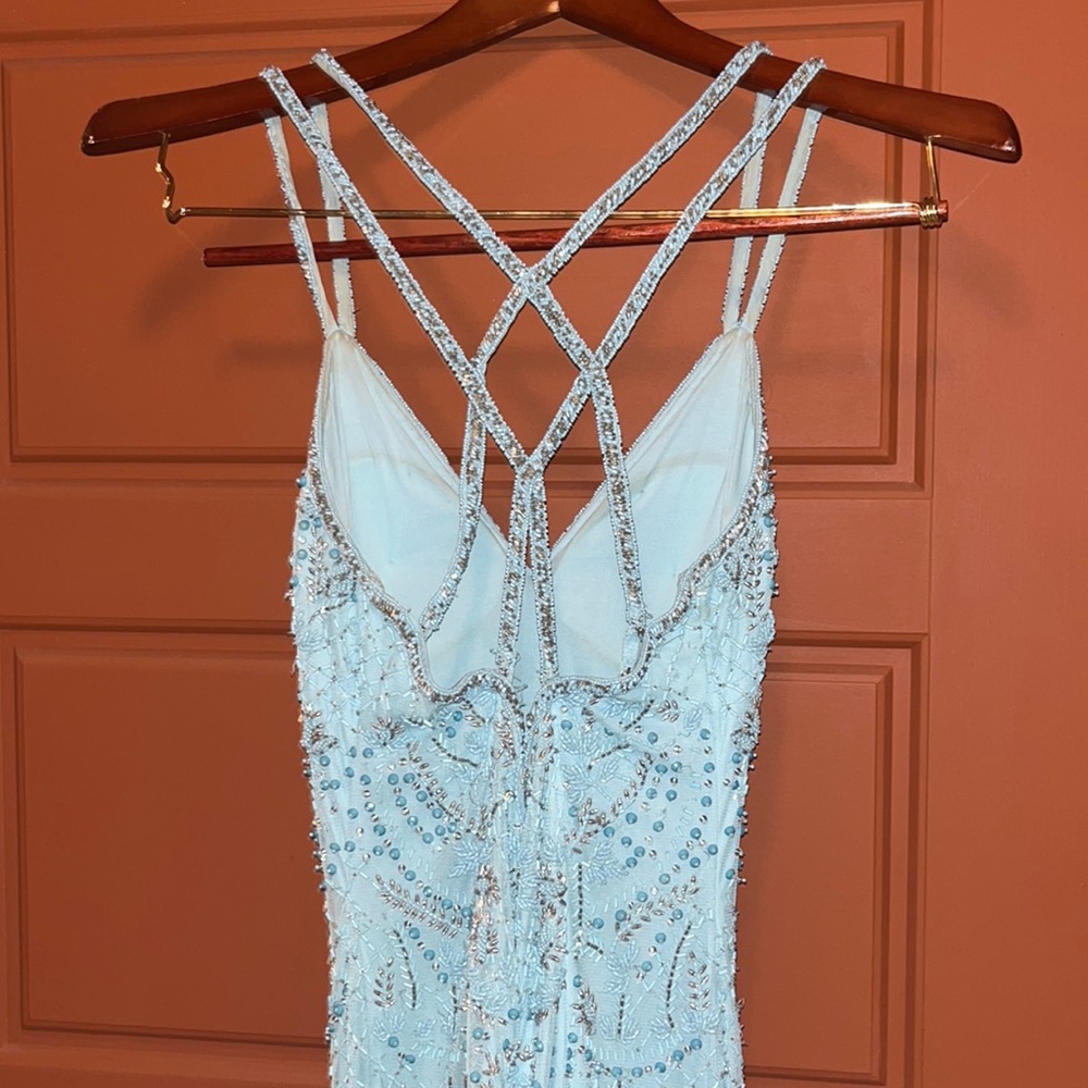 This is a fully hand beaded gown it is a form fitting style